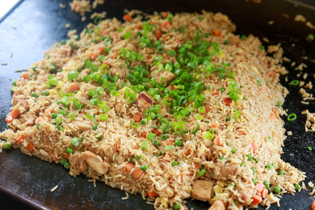 Cooking chicken fried rice on the blackstone