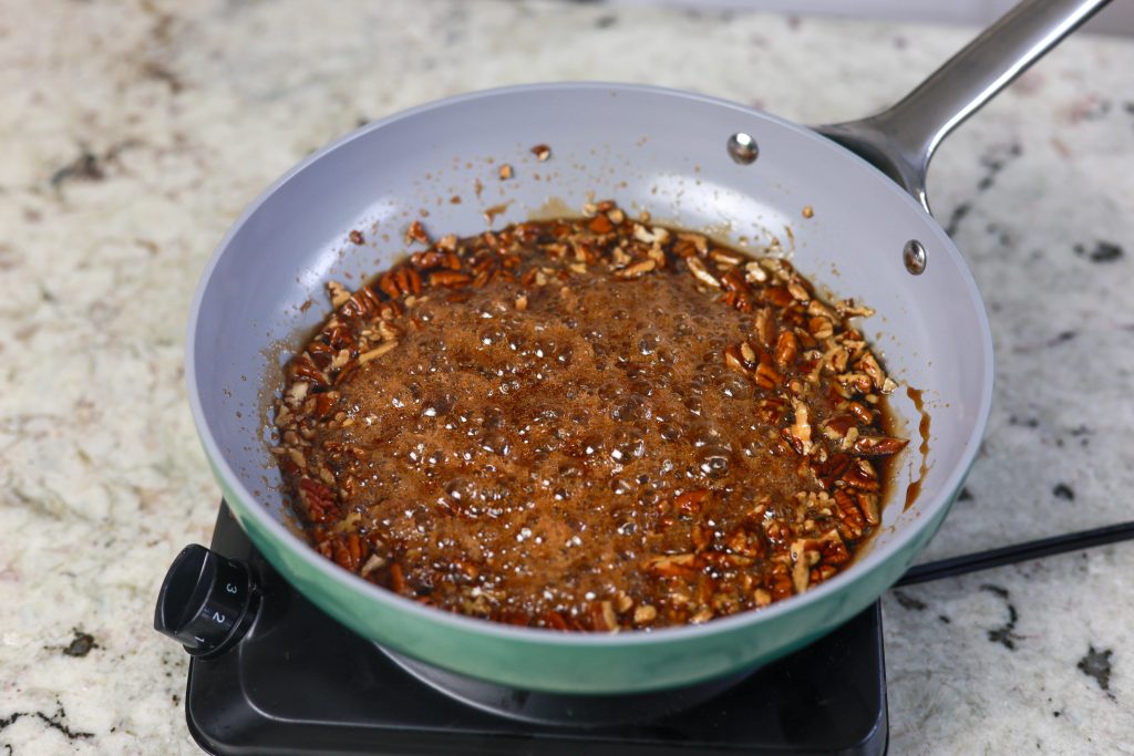 Making a Kalua and brown sugar glaze for pecans