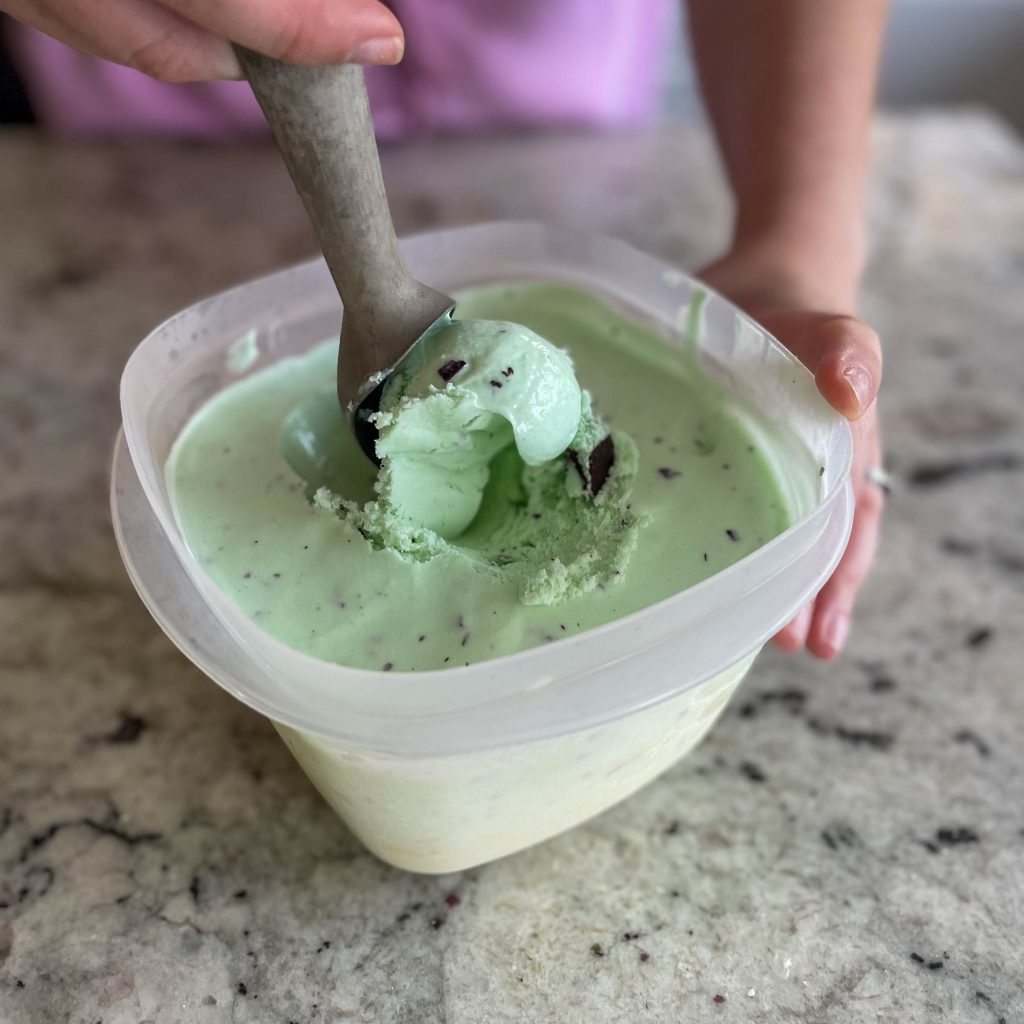 scooping homemade mint chocolate chip ice cream
