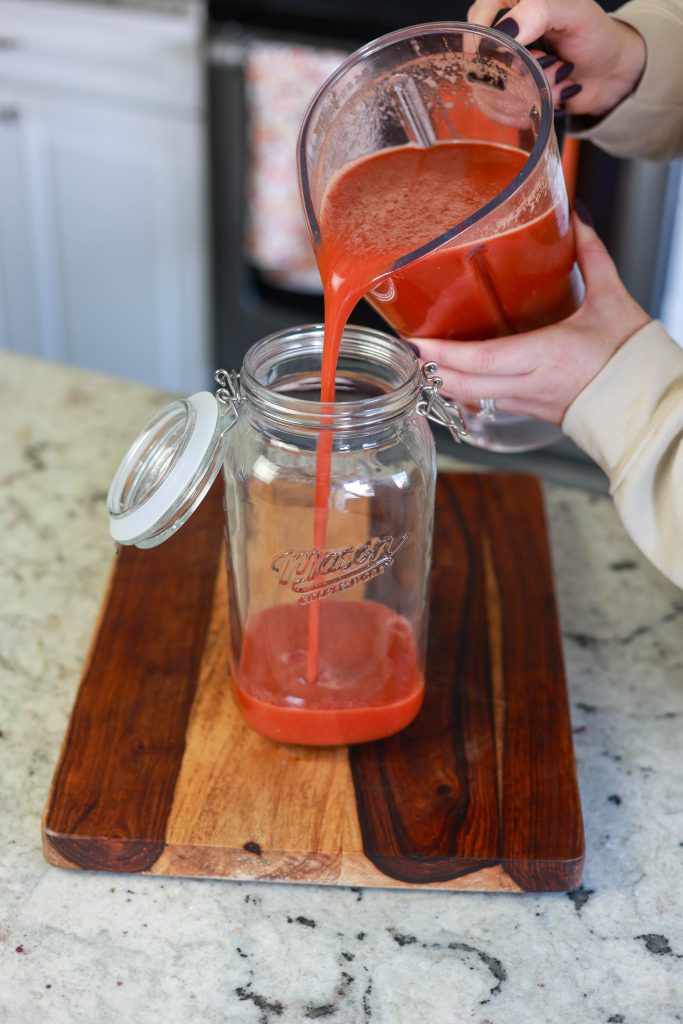 Best Large Batch Bloody Mary Mix Recipe for Brunch Parties 3 pouring large batch bloody mary mix