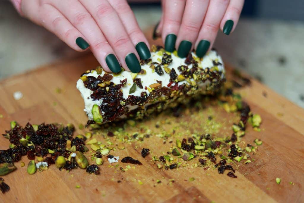 Easy Goat Cheese Appetizer with Cranberries and Pistachios 3 rolling goat cheese appetizer in cranberries and pistachios