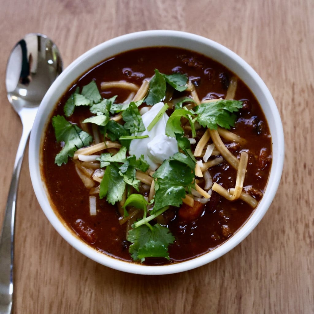 Bowl of this pumpkin chili recipe with toppings