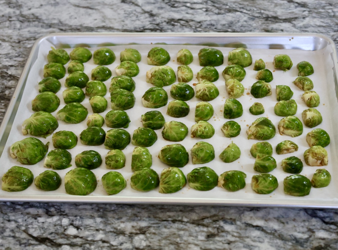 cut maple roasted Brussel sprouts and place on parchment