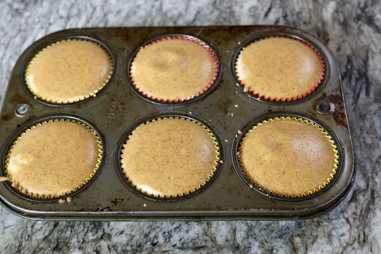 layered pumpkin cheesecake recipe with paper liners