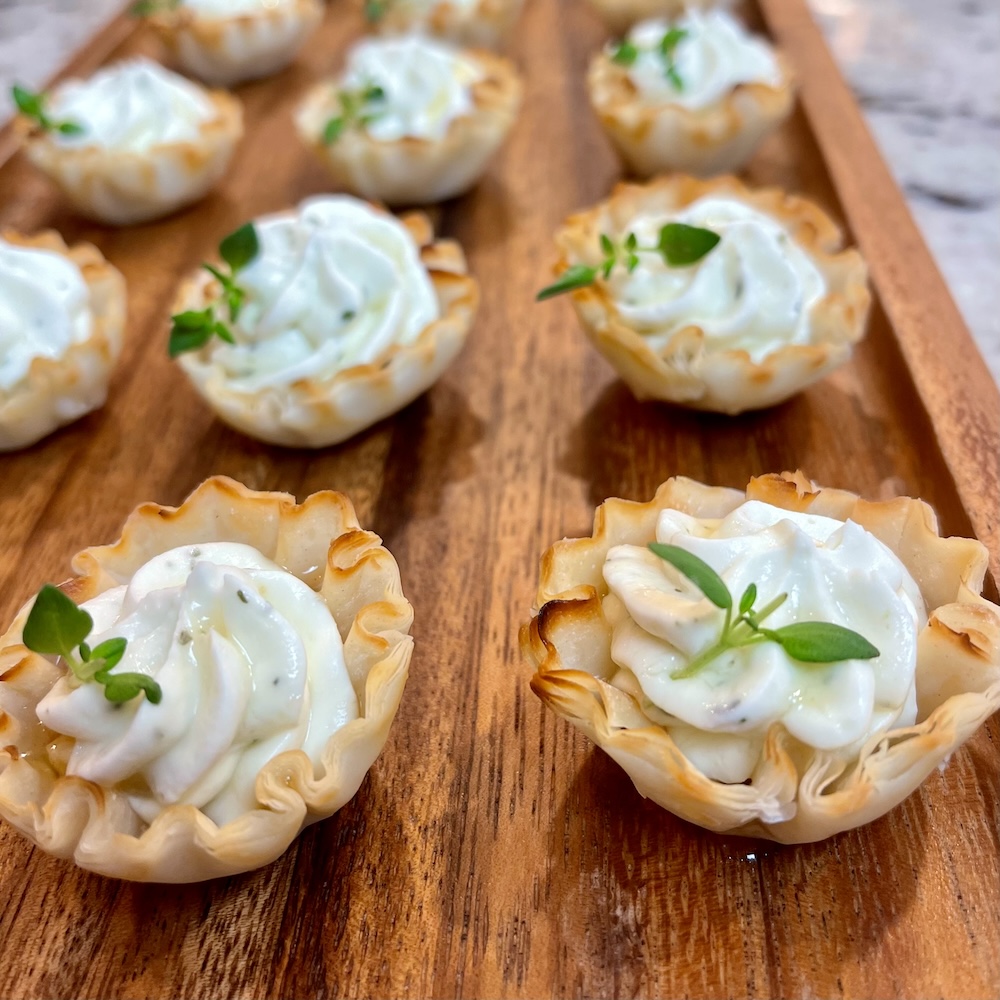 hot honey Boursin phyllo cups with thyme garnish