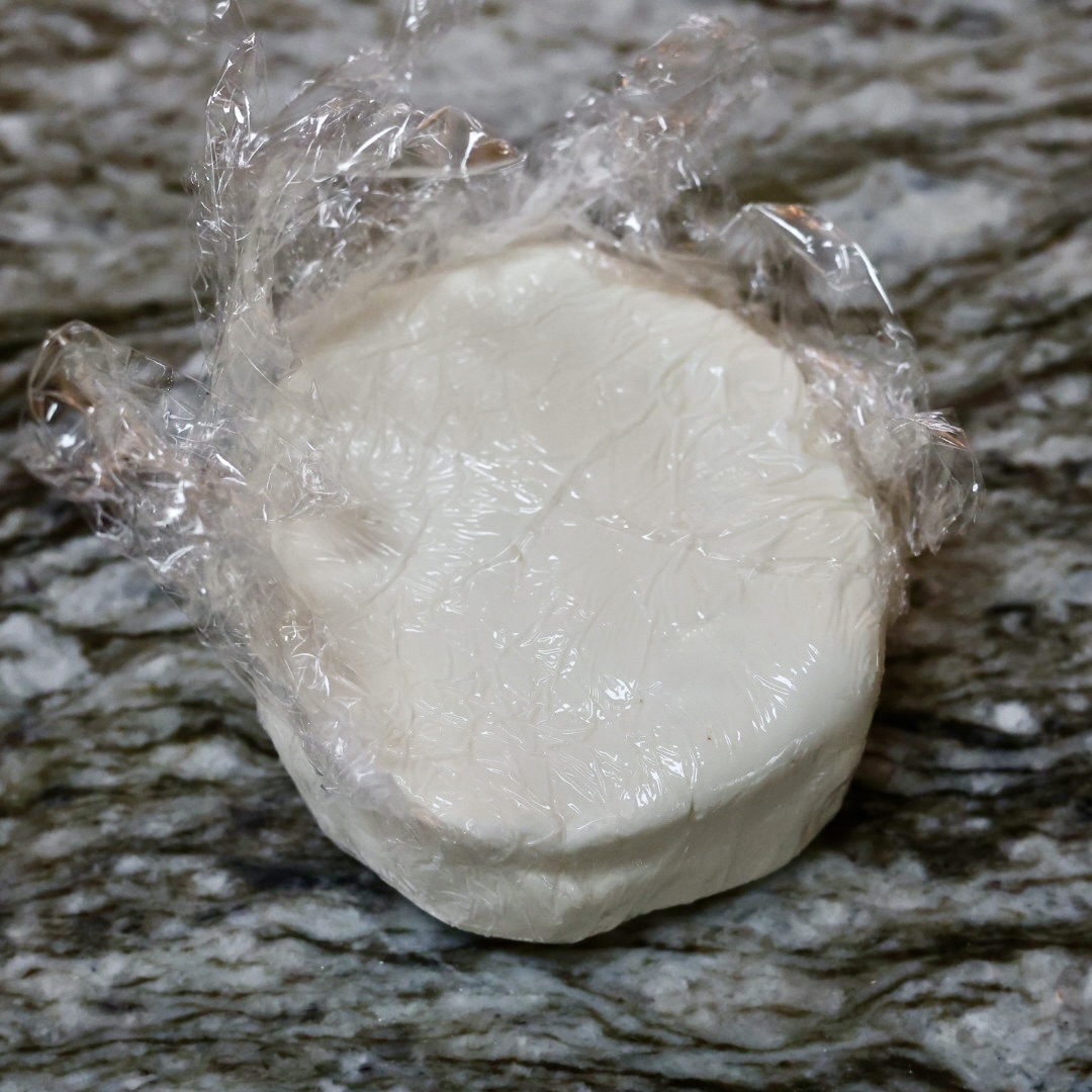 goat cheese in plastic wrap