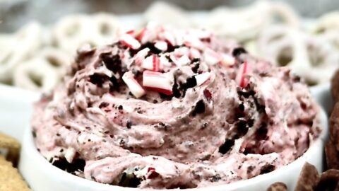 No-bake holiday appetizer dip with crushed candy canes and Oreos.Candy Cane Oreo Cheesecake Dip