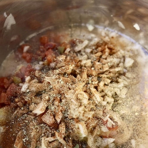 assembling creamy crockpot chicken spaghetti