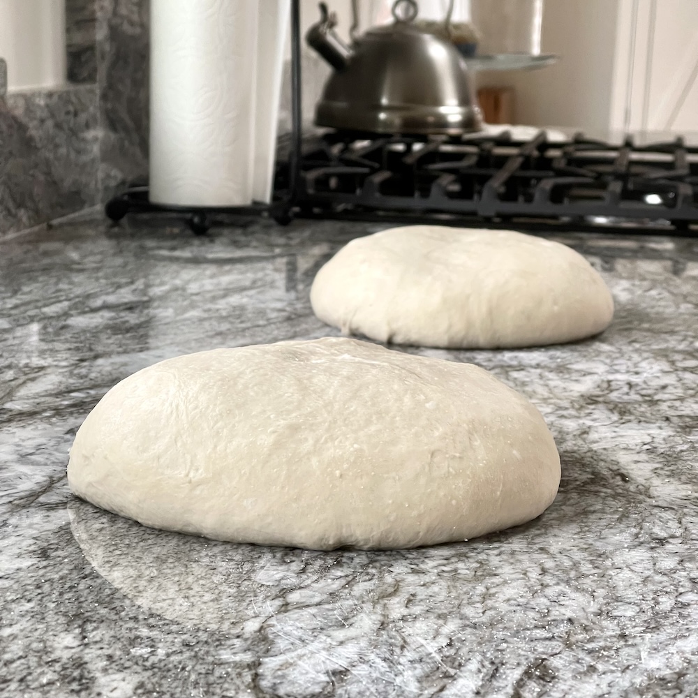 Bench rest stage: Two dough boules shaped and bench resting