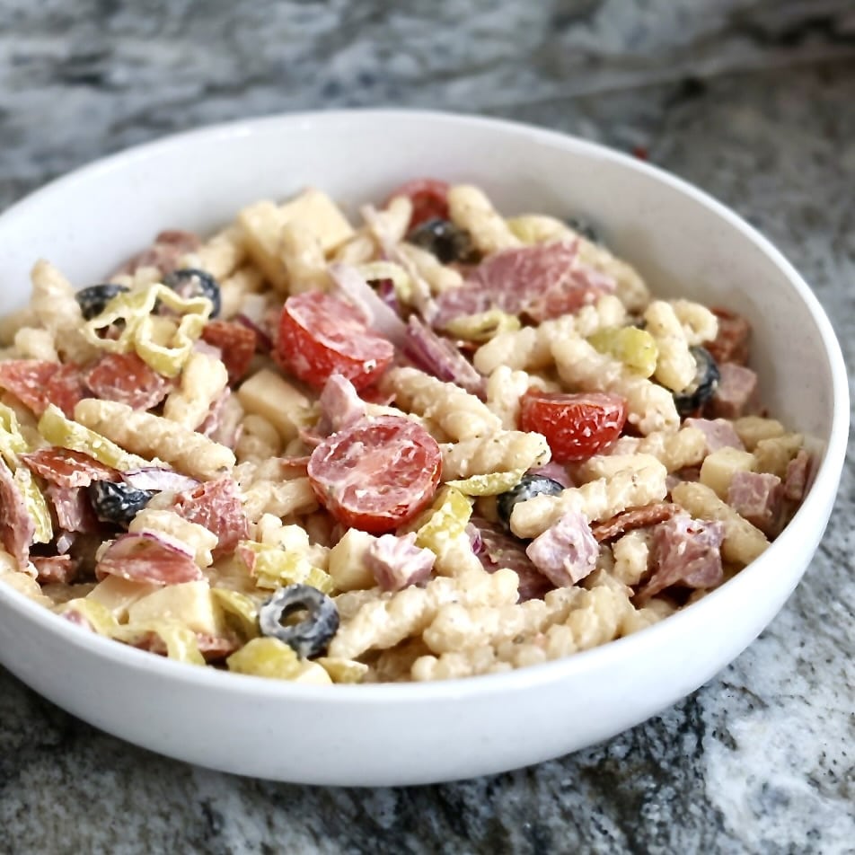 add in all the meats, cheeses and vegetables, except the lettuce