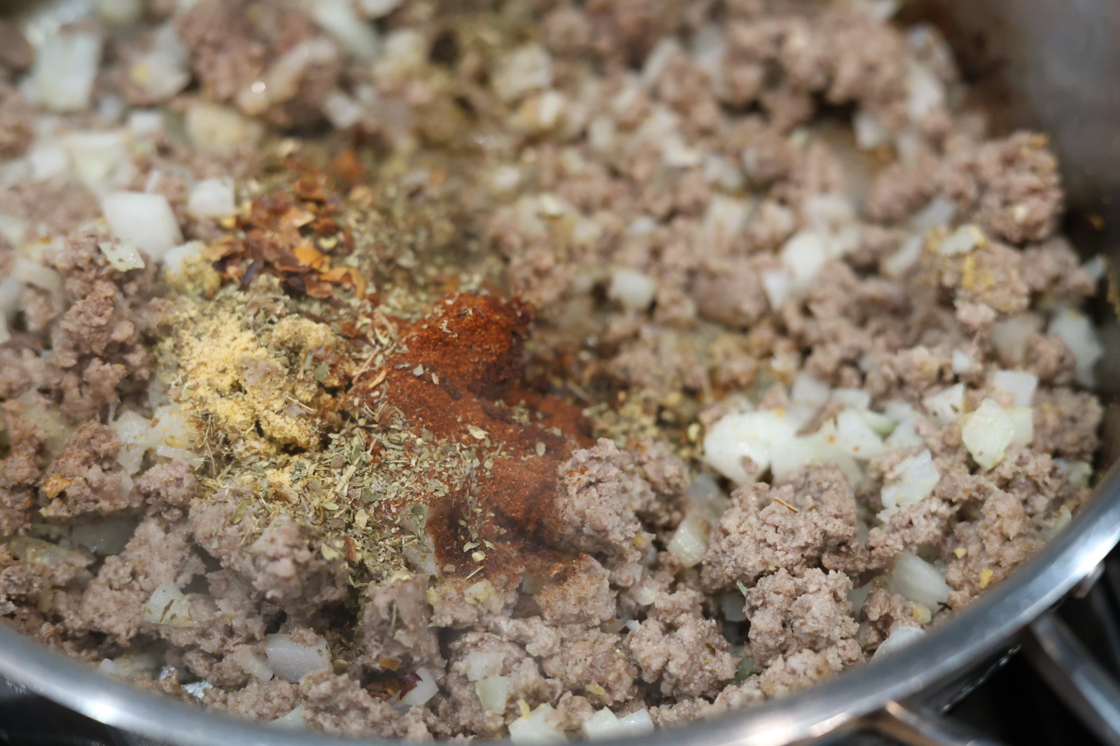 killed with beef, onion and spices for cheesy beef and shells dinner