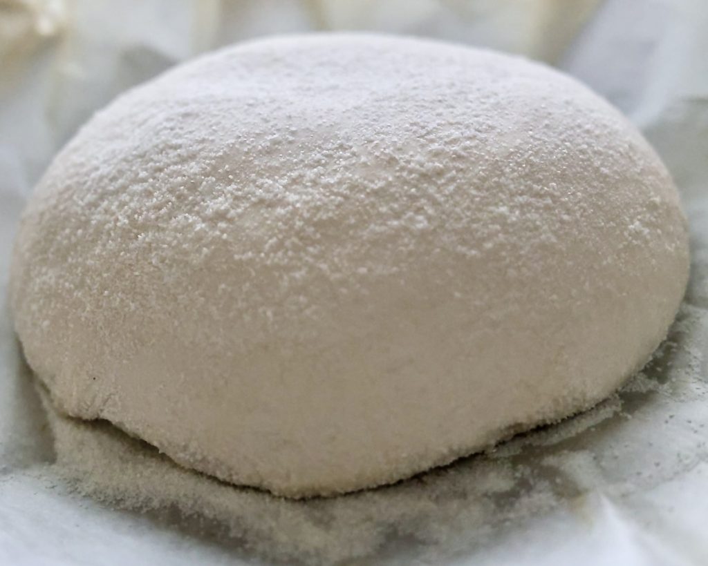 How to Proof Sourdough Bread: Timing, Temperature, and Signs of Under/Overproofing 9 Cold proofed sourdough dough turned out onto parchment holding its shape before