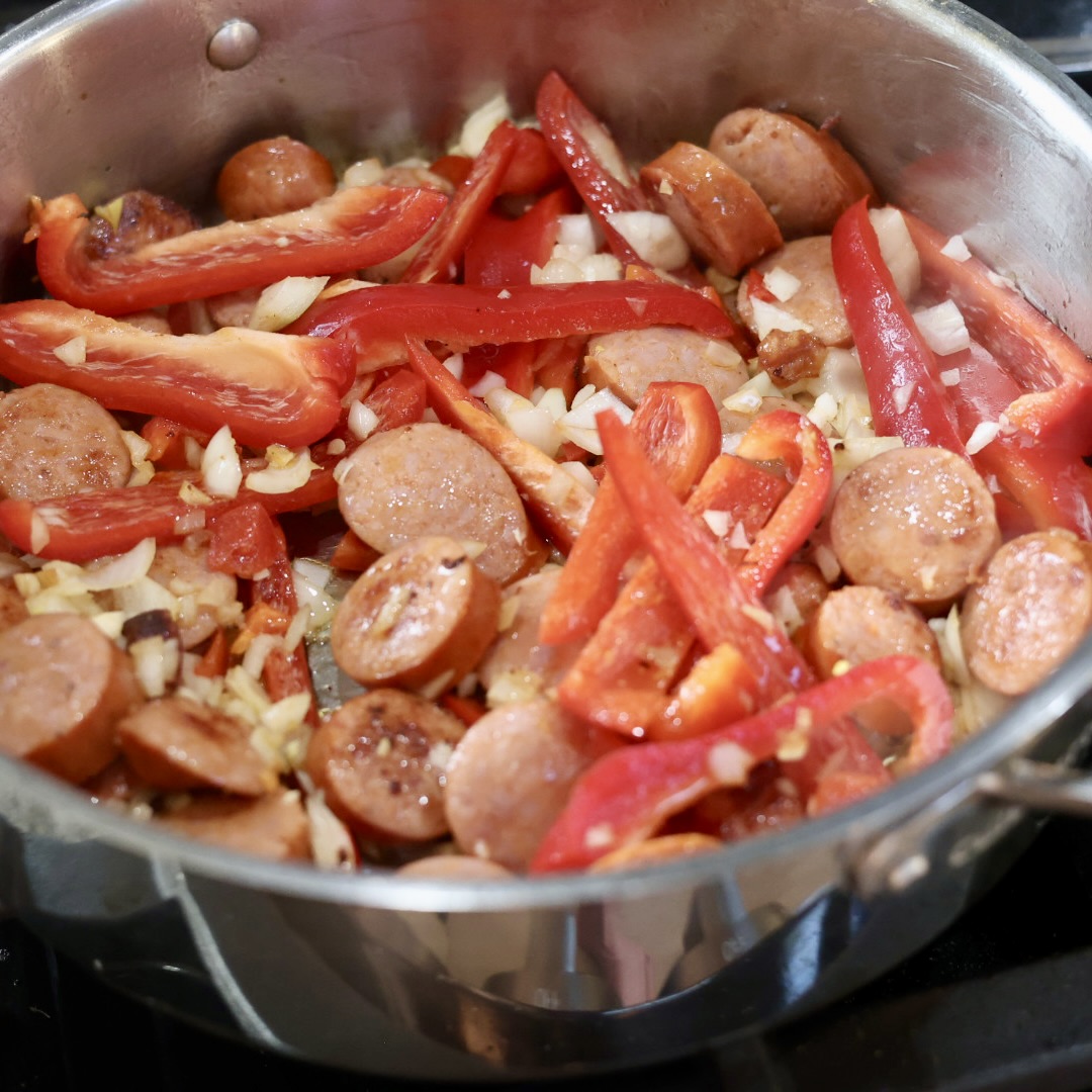 browning the sausage and vegetables