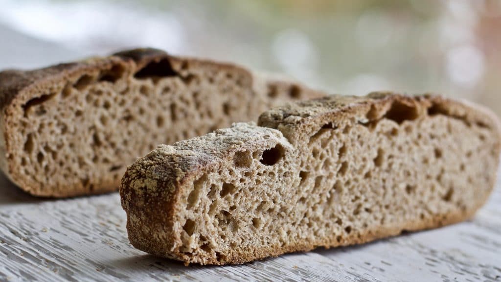 two slices of bread with dense crumb and no oven spring.