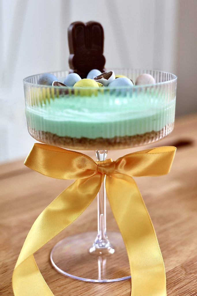 no bake cheesecake cups decorated for Easter with candy toppings
