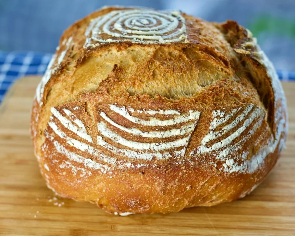 white whole wheat loaf scored for top oven spring