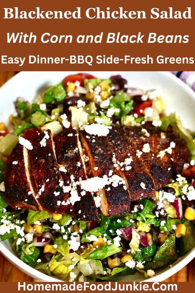 pictured is blackened chicken salad with corn and black beans in a white bowl with chicken slices arranged across the top.